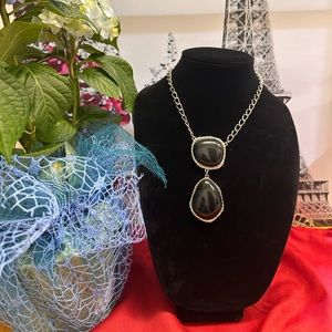 silver tone necklace with Black Stones